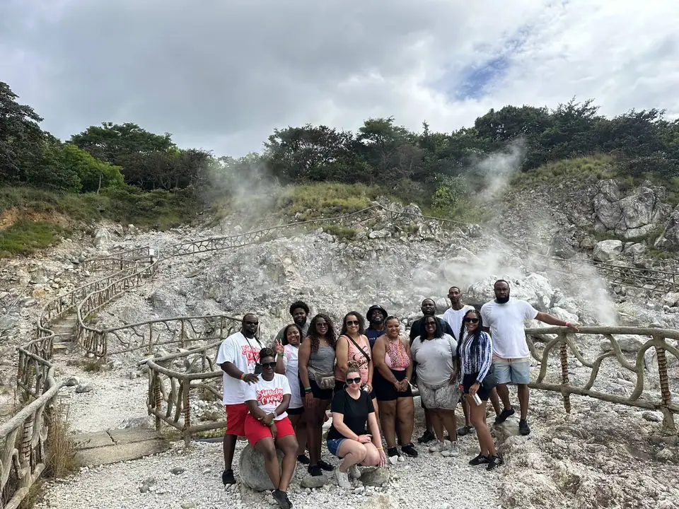 Group of visitors in front of steaming fumaroles at Las Hornillas